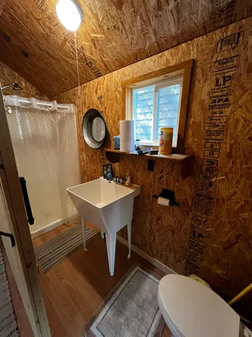 a bed room with a bed and a mirror