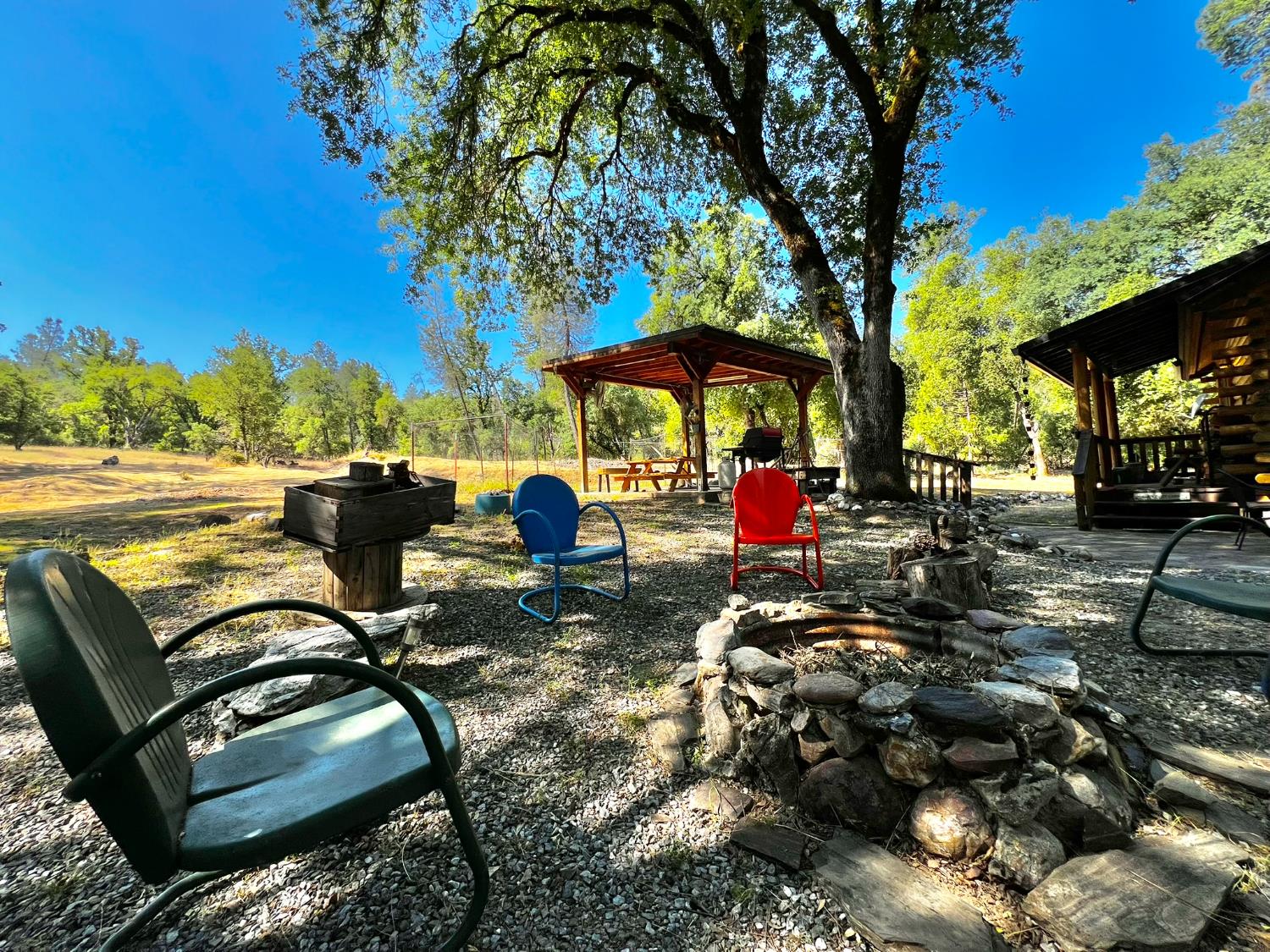 9110 Hidden Valley Road Mountain Ranch, CA 95246 - Photo 6 of 44 a view of a backyard with sitting area
