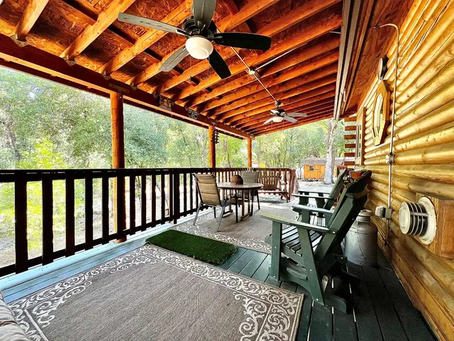 a view of a patio with wooden floor