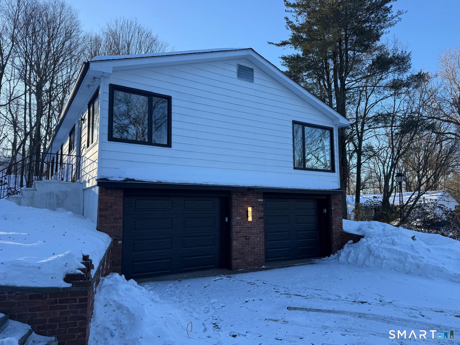 46 Bracewood Road Waterbury, CT 06706 - Photo 3 of 25 a front view of a house with a yard