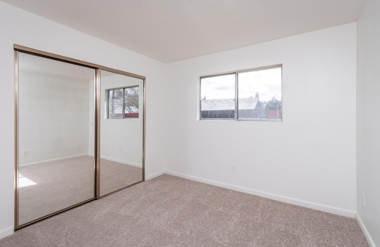 6312 Trenton Way Citrus Heights, CA 95621 - Photo 15 of 27 an empty room with windows and closet