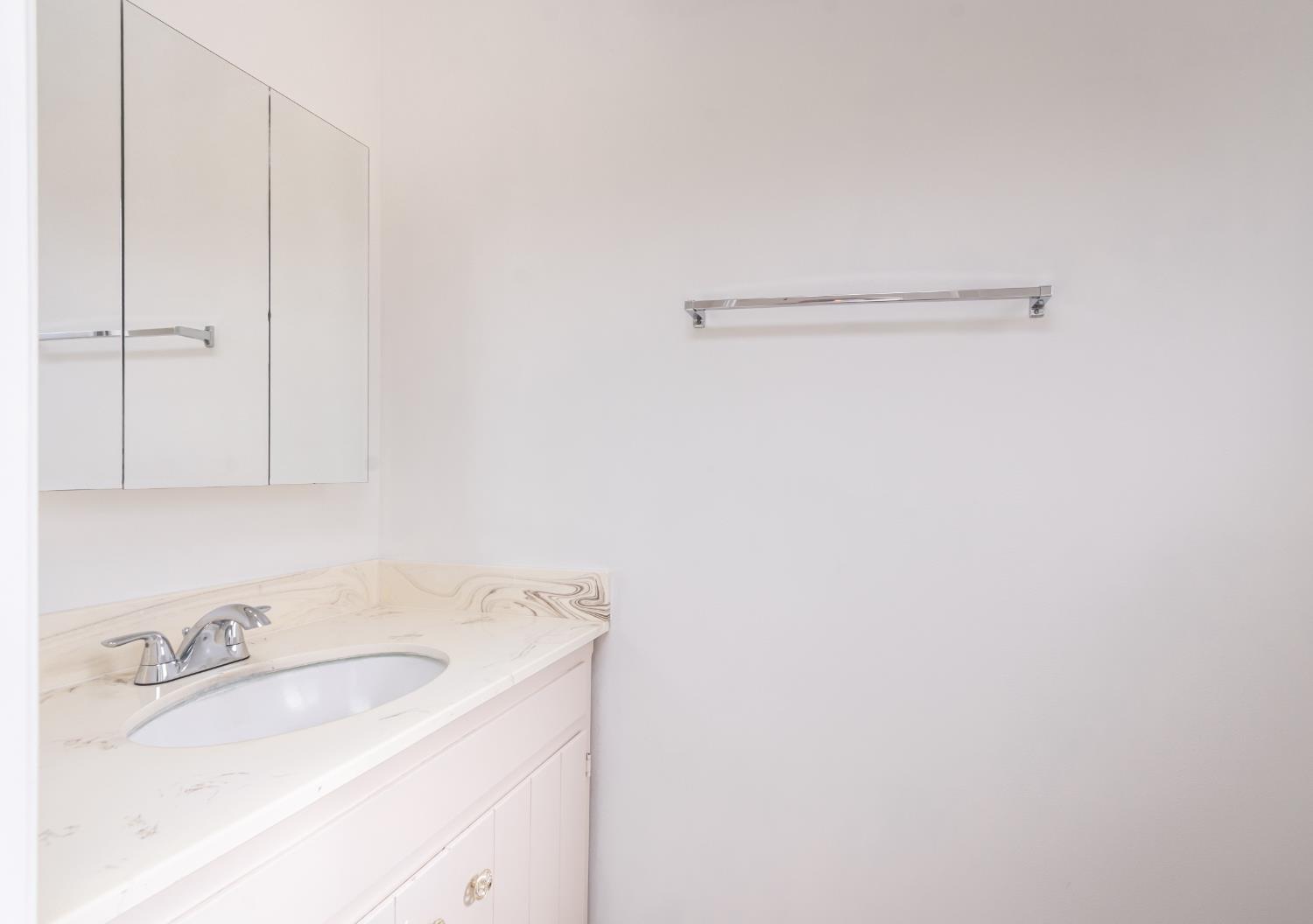 6312 Trenton Way Citrus Heights, CA 95621 - Photo 22 of 27 a bathroom with a sink and cabinets