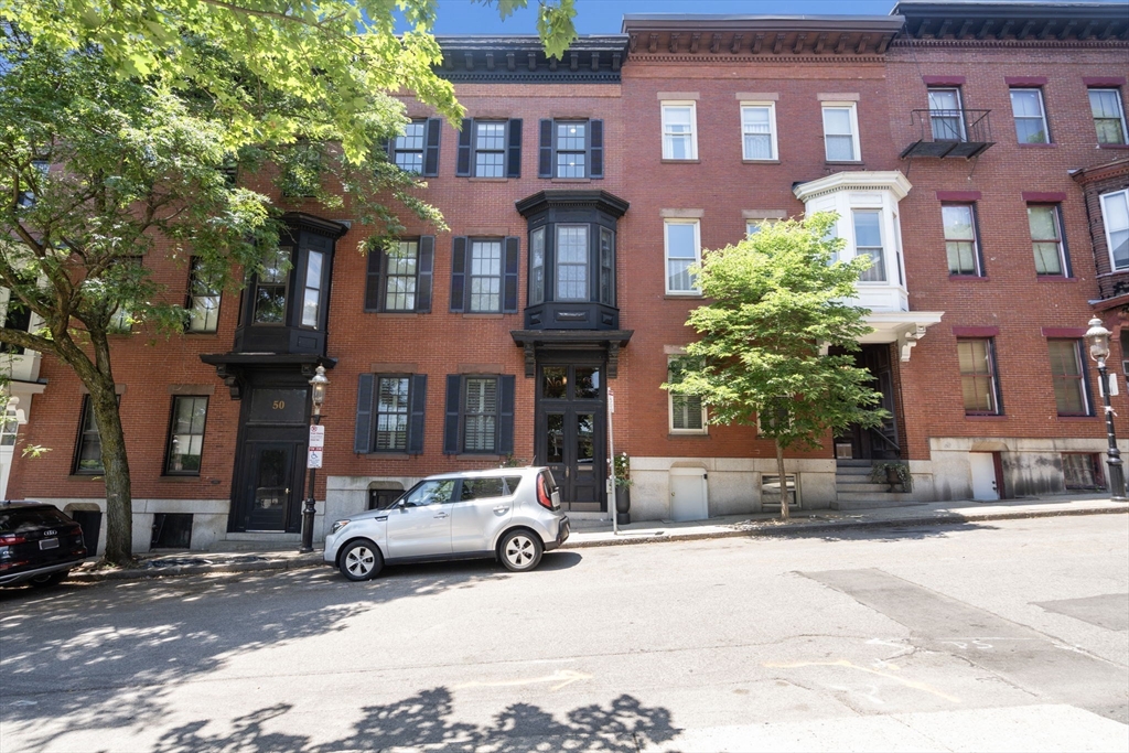 48 Mt Vernon Street, Unit 3 Boston, MA 02129 - Photo 1 of 31 a car parked in front of a brick building