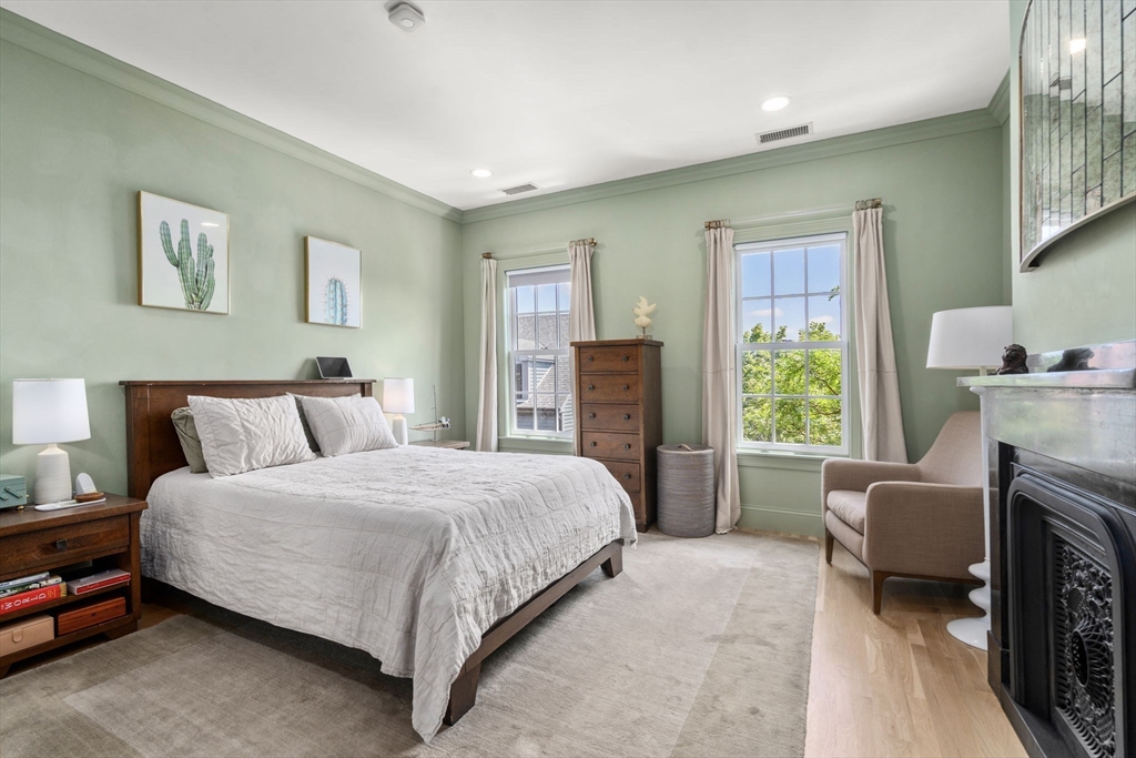 48 Mt Vernon Street, Unit 3 Boston, MA 02129 - Photo 11 of 31 a bedroom with a bed and a couch
