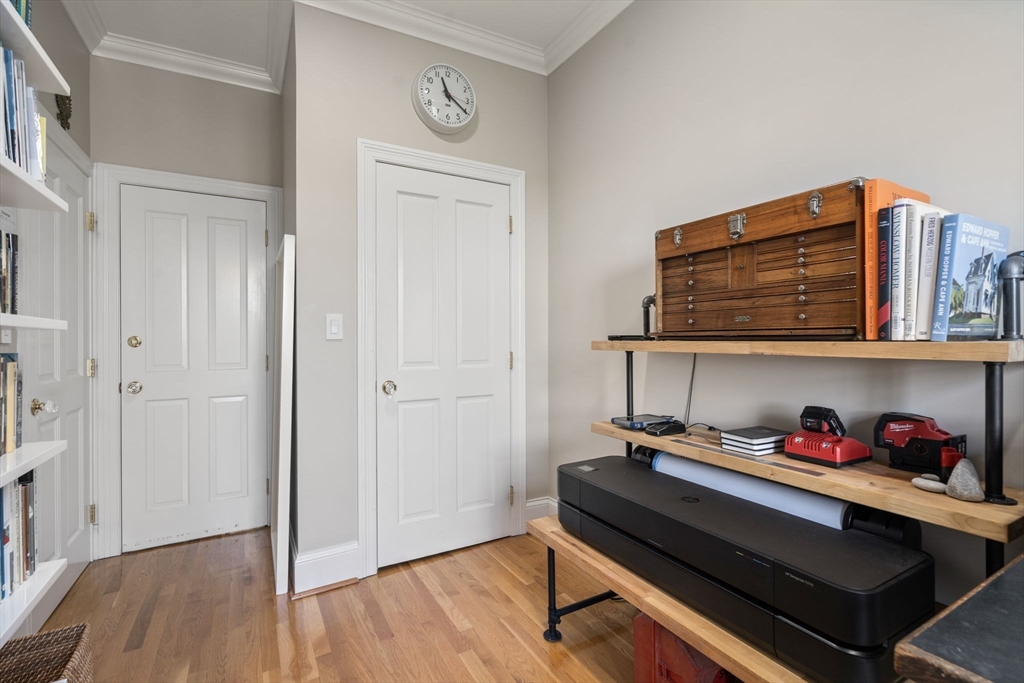 48 Mt Vernon Street, Unit 3 Boston, MA 02129 - Photo 17 of 31 a room that has a bed and a wooden floor
