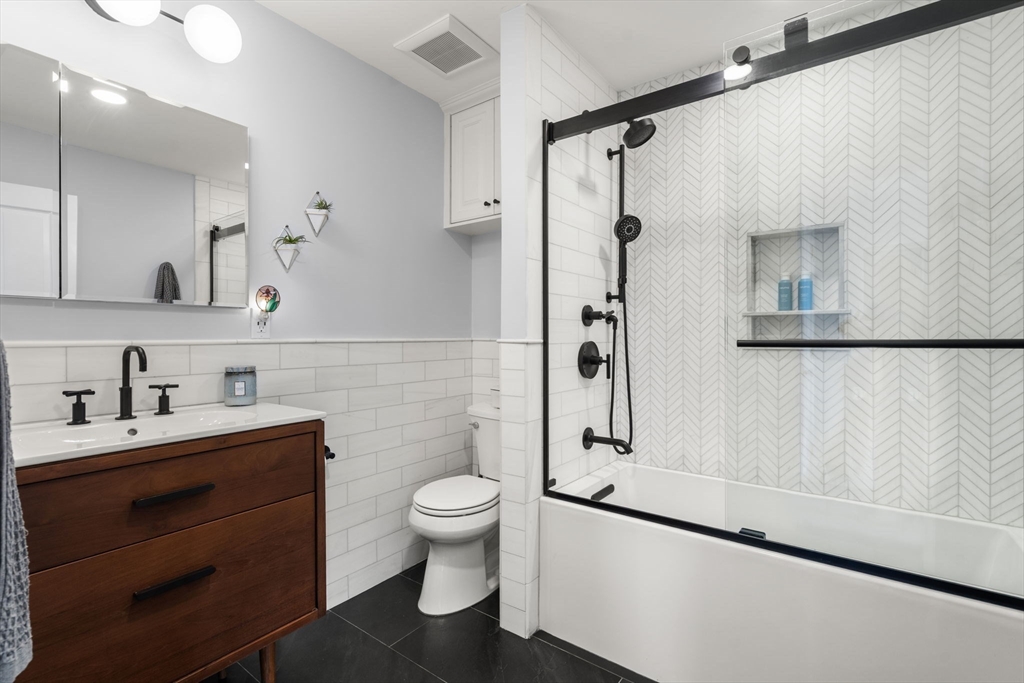 48 Mt Vernon Street, Unit 3 Boston, MA 02129 - Photo 18 of 31 a bathroom with a sink a toilet and shower