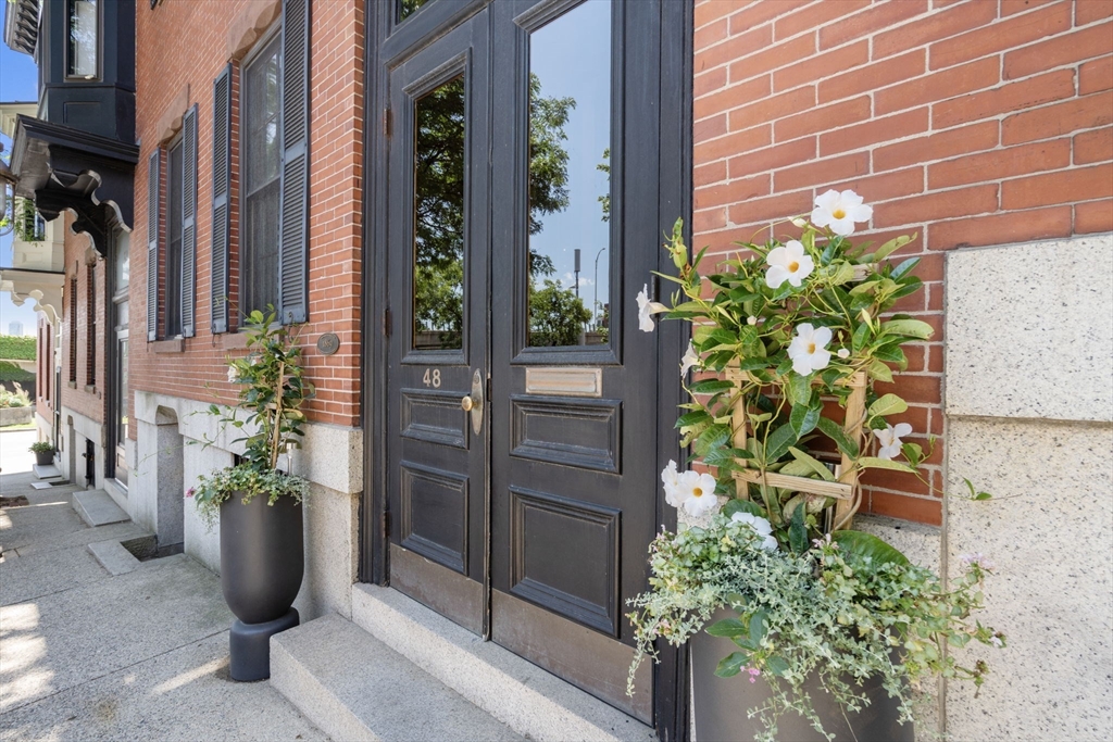 48 Mt Vernon Street, Unit 3 Boston, MA 02129 - Photo 2 of 31 a potted plant sitting in front of a building