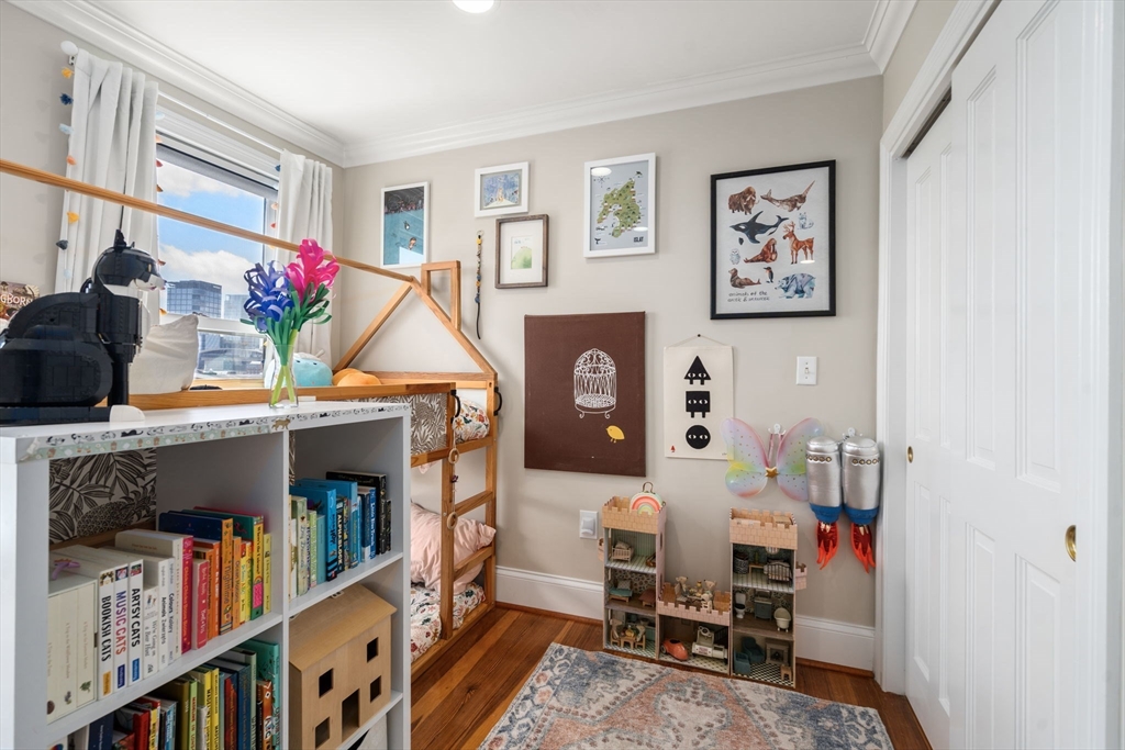 48 Mt Vernon Street, Unit 3 Boston, MA 02129 - Photo 23 of 31 a living room with furniture and a book shelf