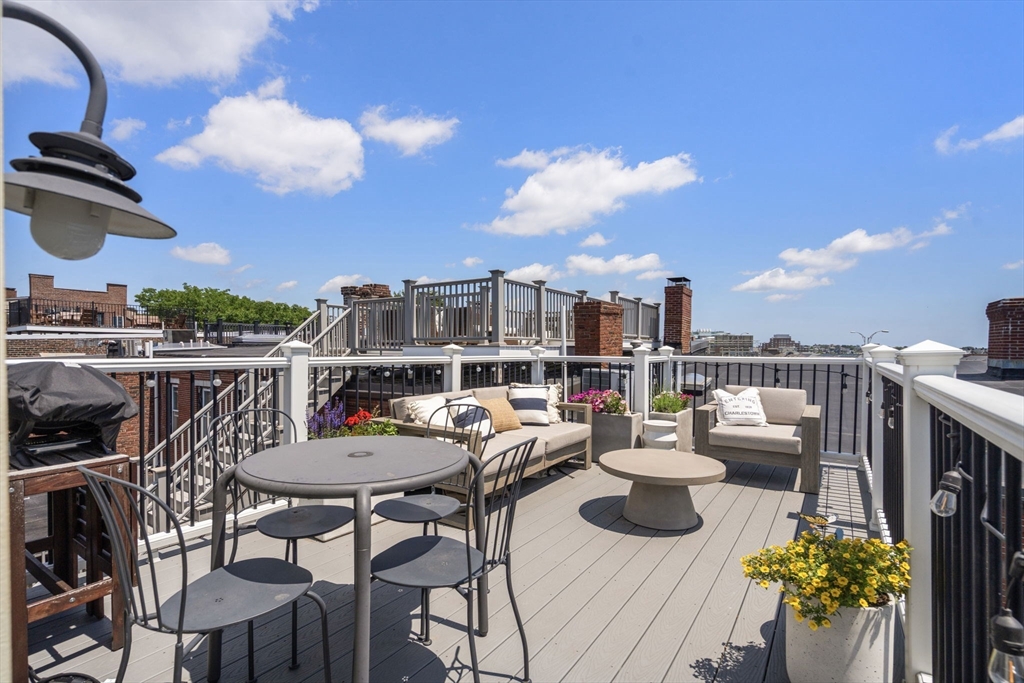 48 Mt Vernon Street, Unit 3 Boston, MA 02129 - Photo 24 of 31 a view of a terrace with furniture and a potted plant