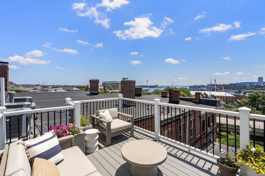 48 Mt Vernon Street, Unit 3 Boston, MA 02129 - Photo 28 of 31 a view of a roof deck with couches