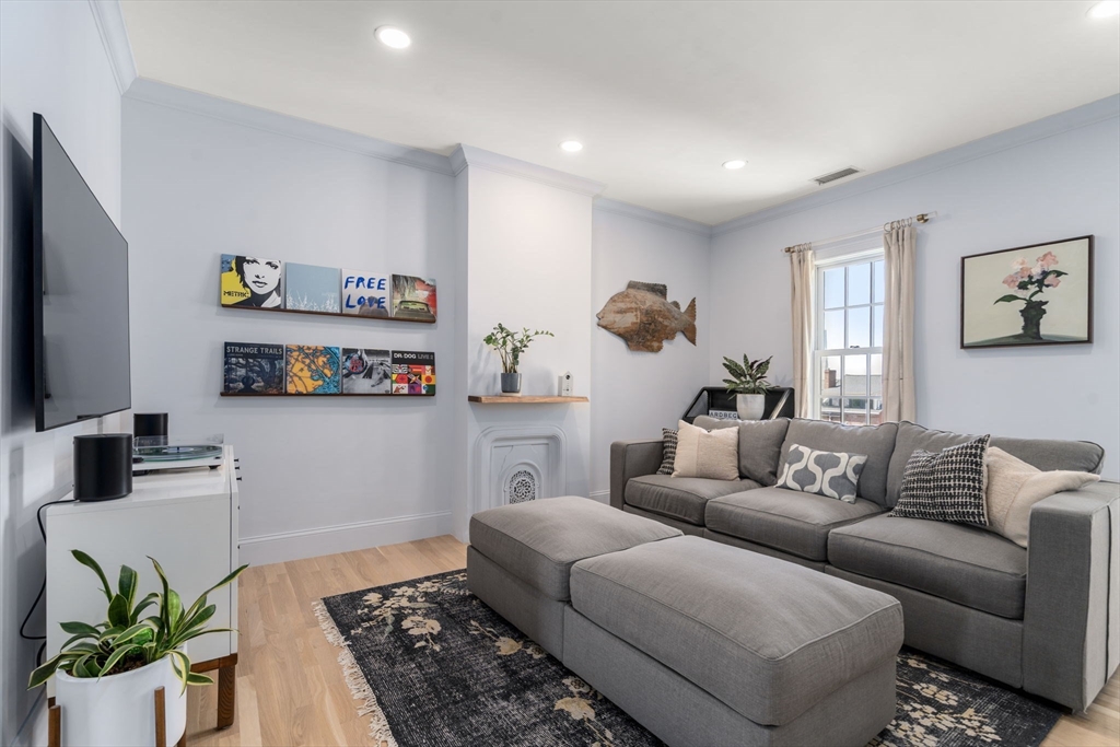 48 Mt Vernon Street, Unit 3 Boston, MA 02129 - Photo 4 of 31 a living room with furniture and a couch