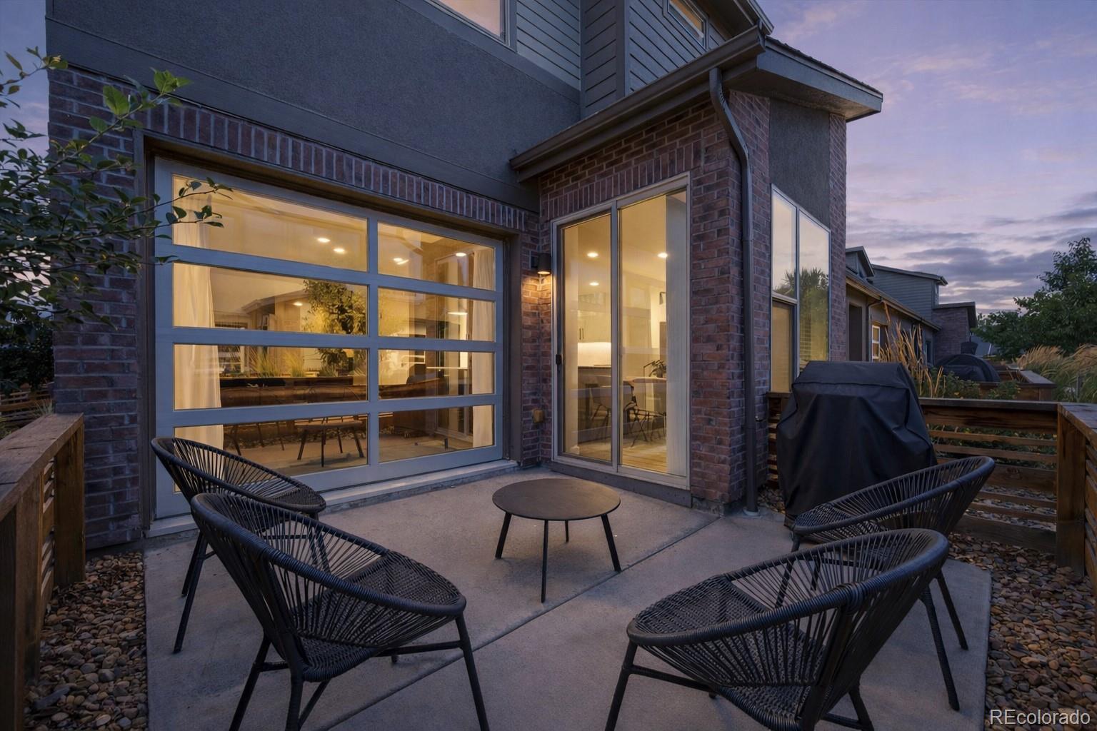 a view of a chairs and table in the patio