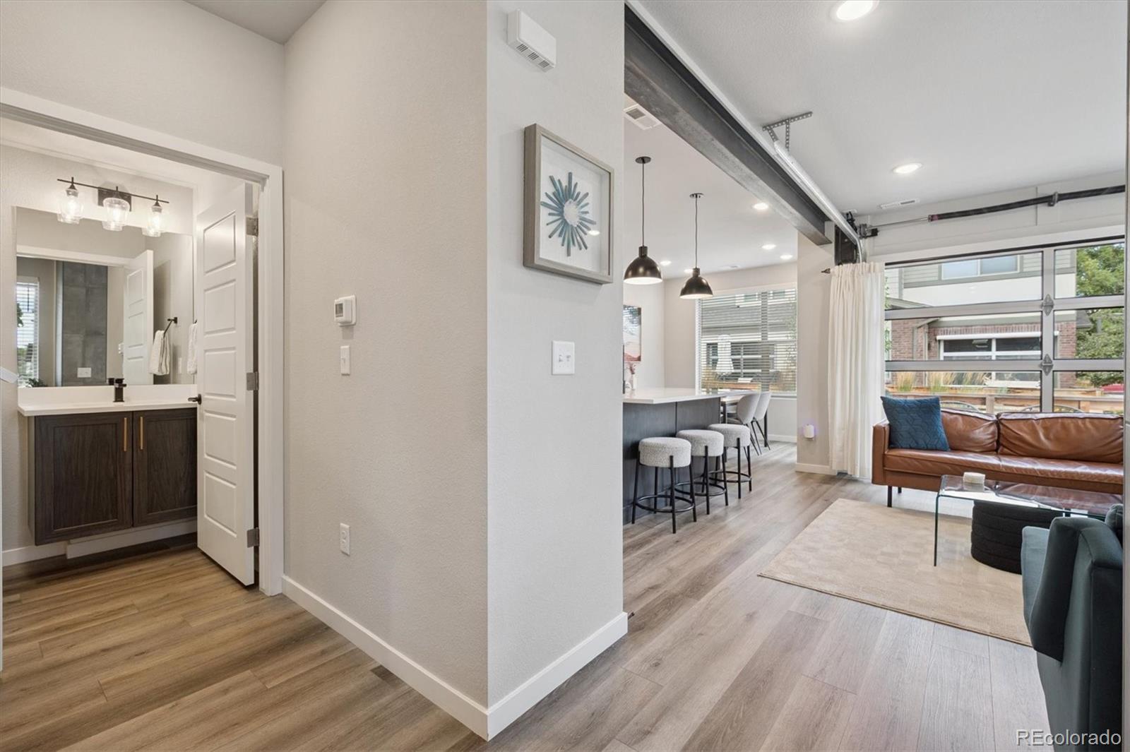 11772 West 45th Place Wheat Ridge, CO 80033 - Photo 13 of 25 a view of a living room and dining room
