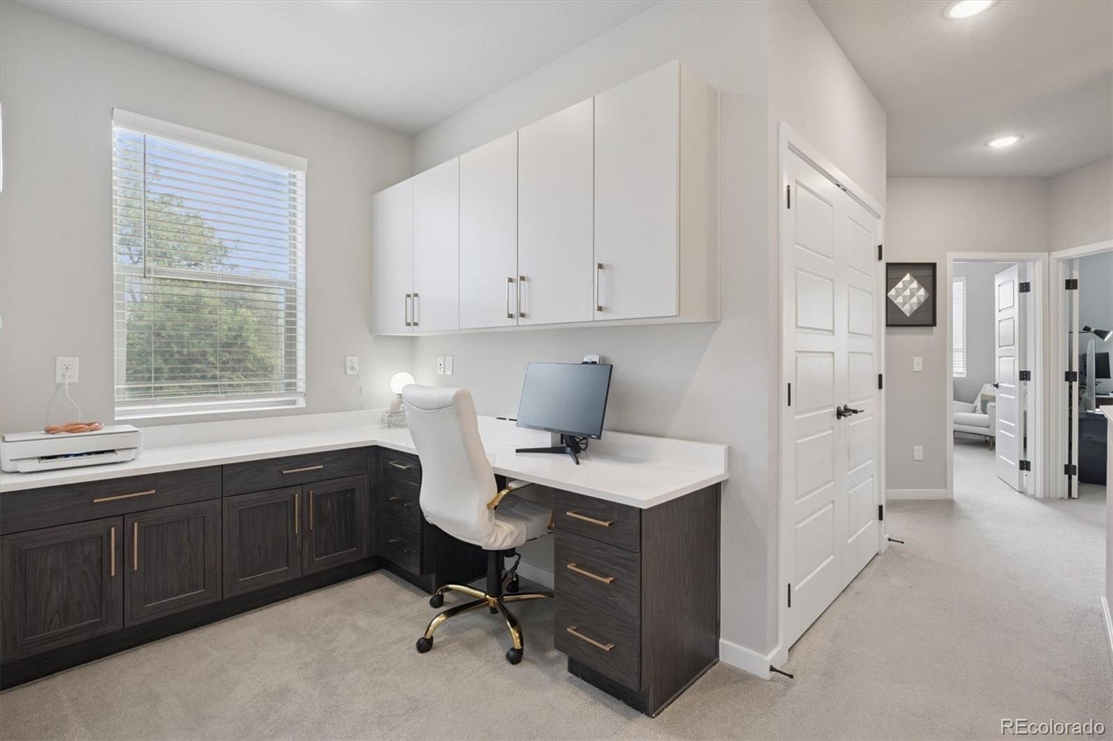 11772 West 45th Place Wheat Ridge, CO 80033 - Photo 21 of 25 a view of a kitchen with a sink cabinets and wooden floor