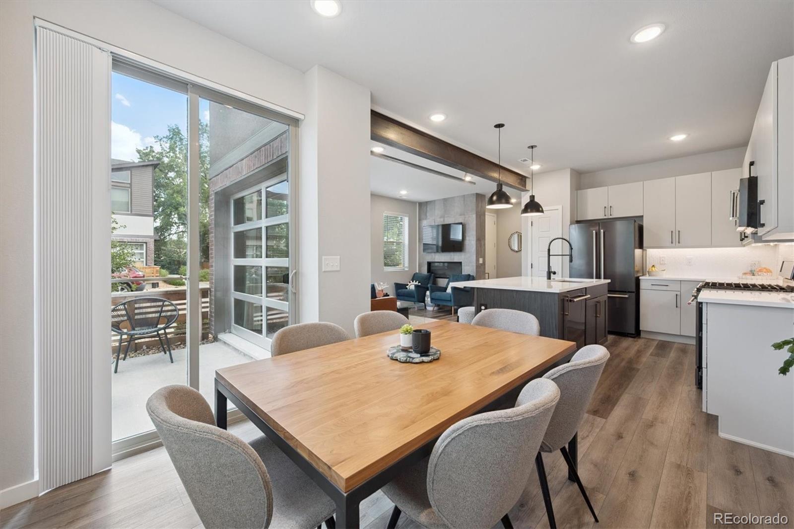 11772 West 45th Place Wheat Ridge, CO 80033 - Photo 4 of 25 a dining room with furniture and window