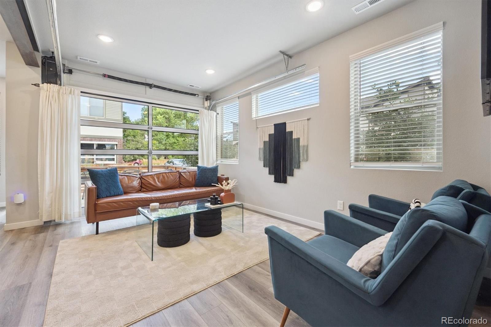 11772 West 45th Place Wheat Ridge, CO 80033 - Photo 10 of 25 a living room with furniture and a large window
