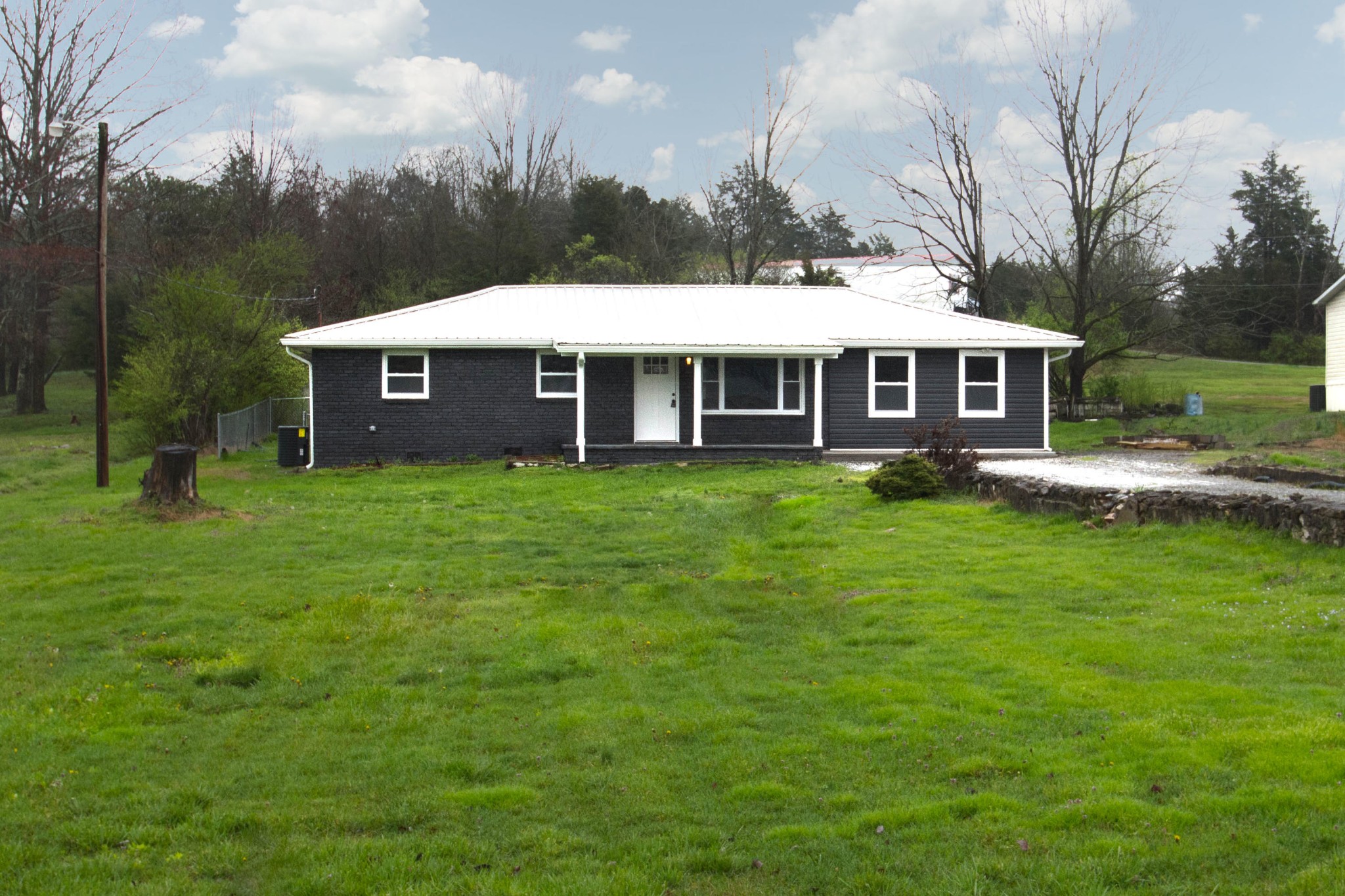 412 Cash Road Knoxville, TN 37924 - Photo 1 of 23 a view of a house with a yard and sitting area