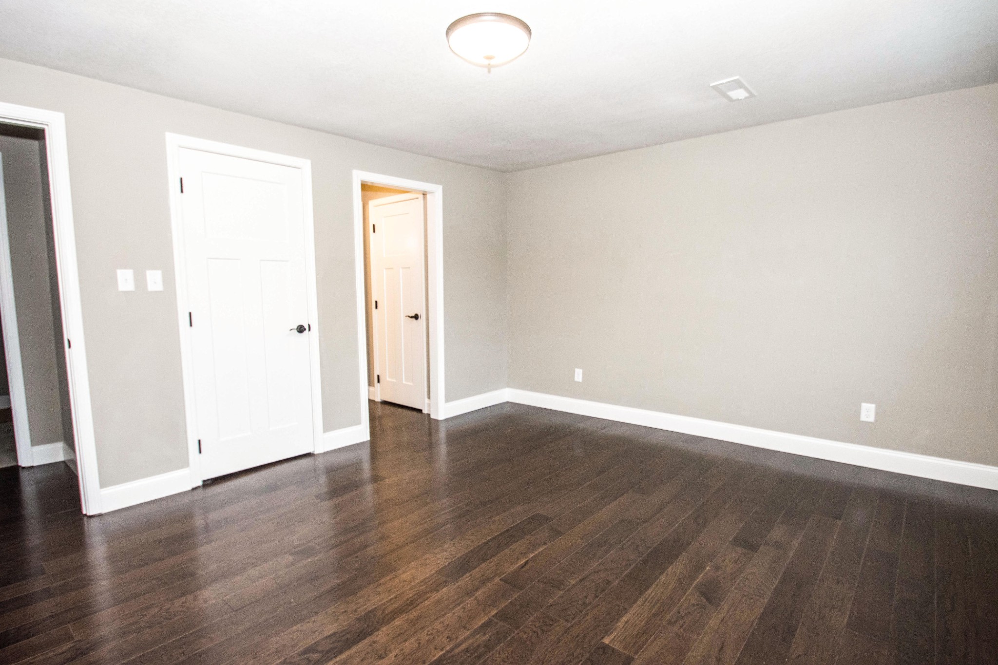 412 Cash Road Knoxville, TN 37924 - Photo 12 of 23 an empty room with wooden floor and windows