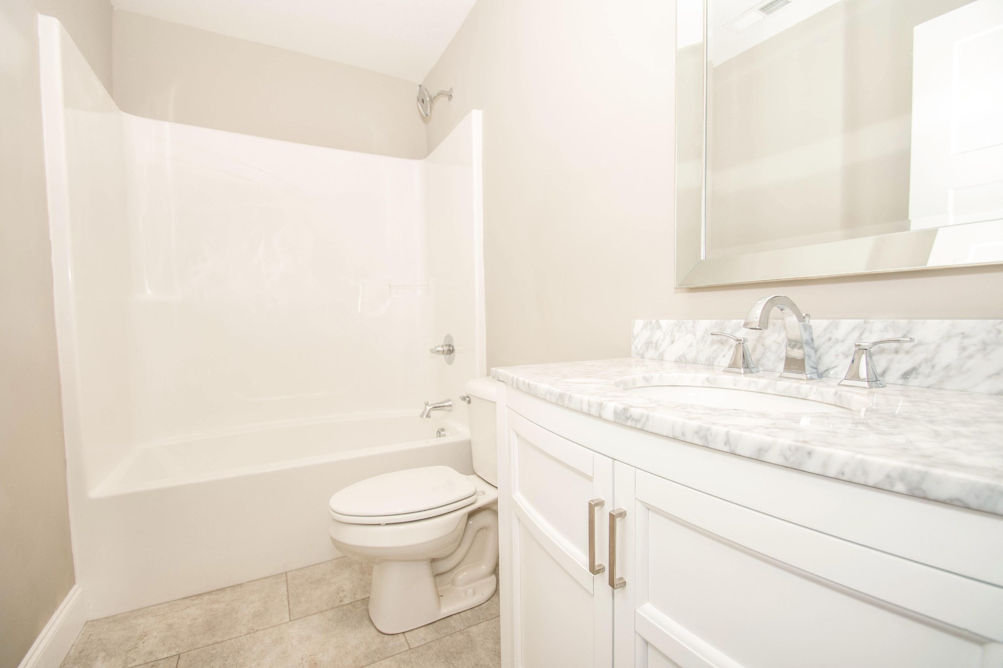 412 Cash Road Knoxville, TN 37924 - Photo 14 of 23 a bathroom with a granite countertop sink a toilet and shower