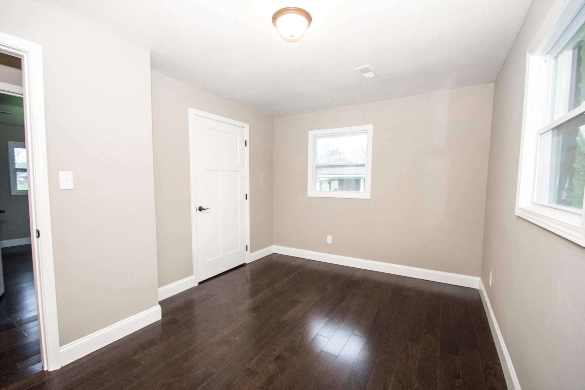 412 Cash Road Knoxville, TN 37924 - Photo 17 of 23 an empty room with wooden floor and windows