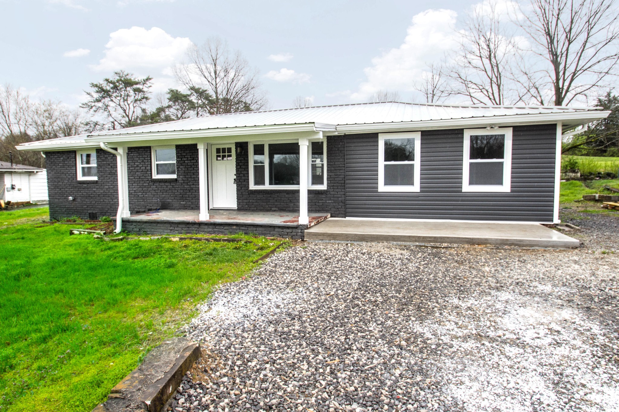 412 Cash Road Knoxville, TN 37924 - Photo 2 of 23 a front view of a house with garden