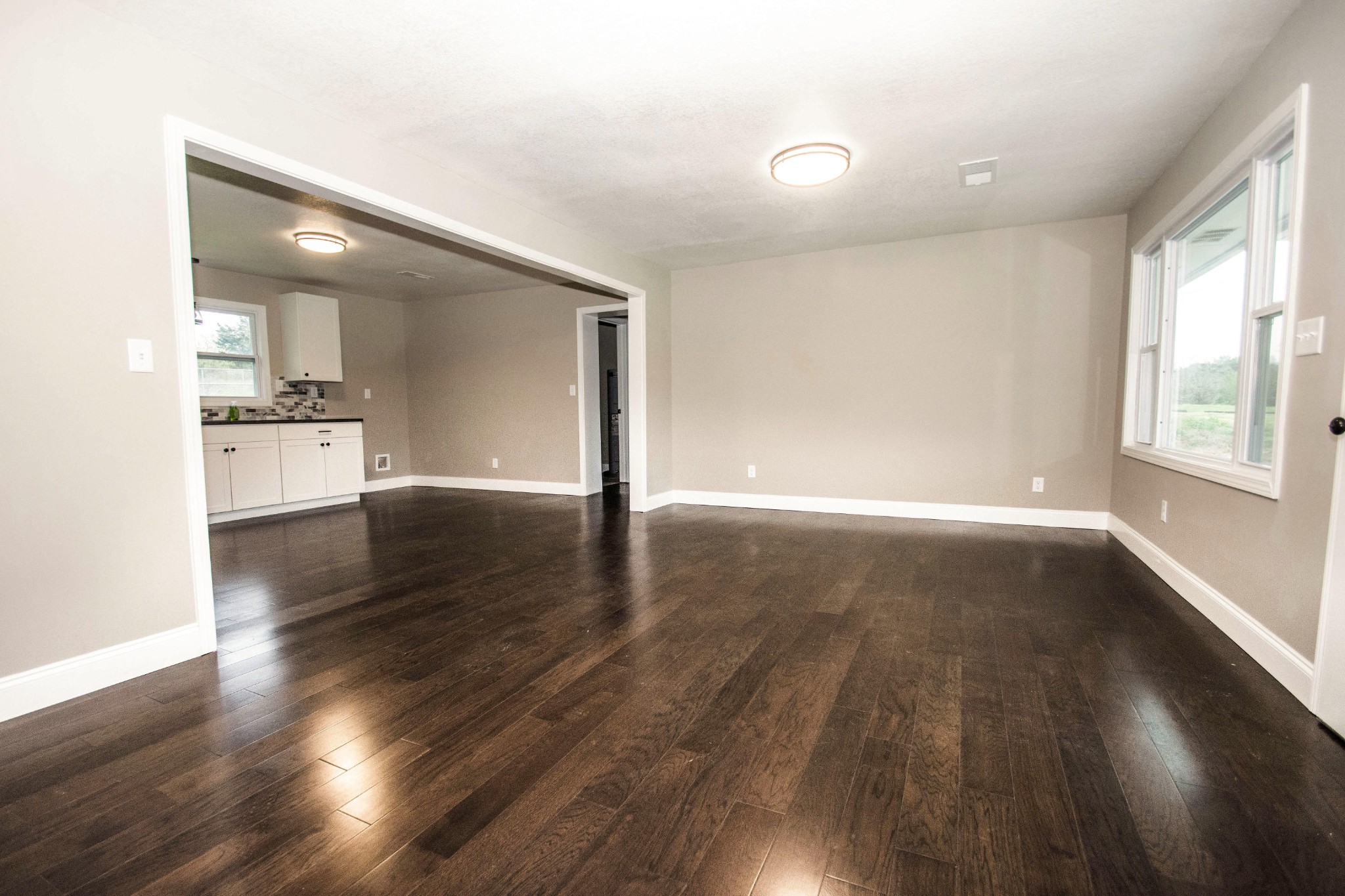 412 Cash Road Knoxville, TN 37924 - Photo 3 of 23 an empty room with wooden floor and windows