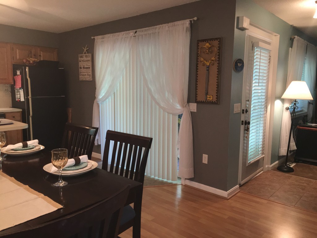 49 Captain Eames Circle, Unit 49 Ashland, MA 01721 - Photo 4 of 12 a view of a dining room with furniture window and wooden floor