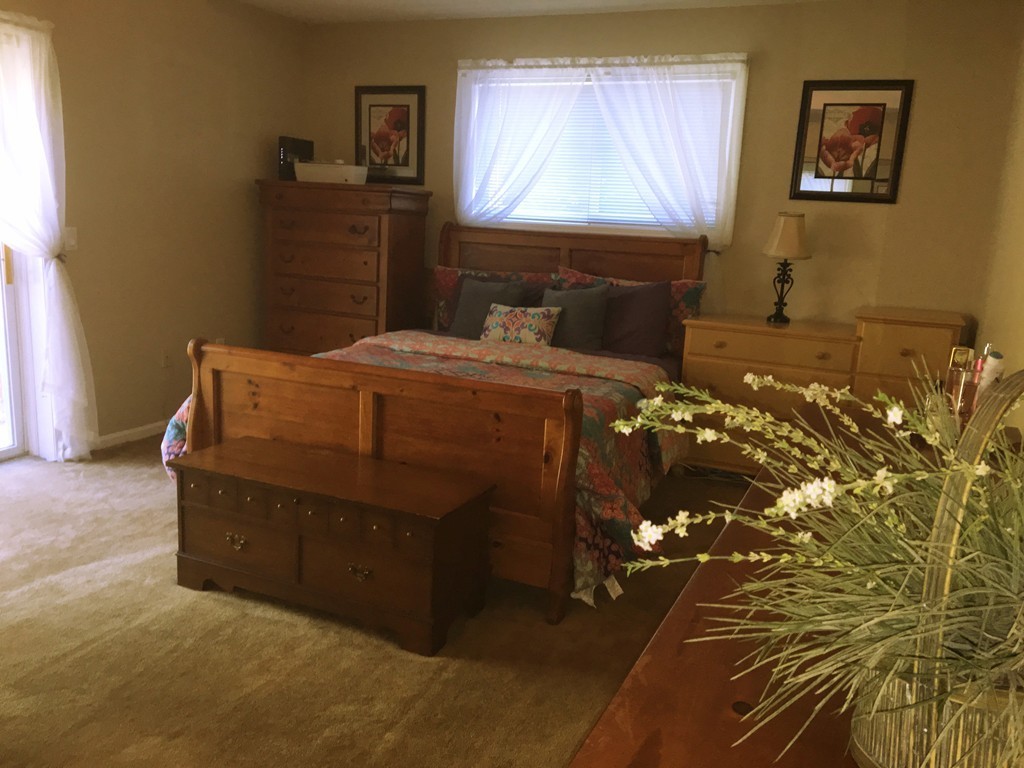 49 Captain Eames Circle, Unit 49 Ashland, MA 01721 - Photo 8 of 12 a bed room with a bed and a window