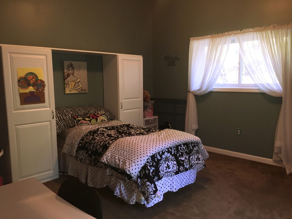 49 Captain Eames Circle, Unit 49 Ashland, MA 01721 - Photo 10 of 12 a bedroom with a bed and a window