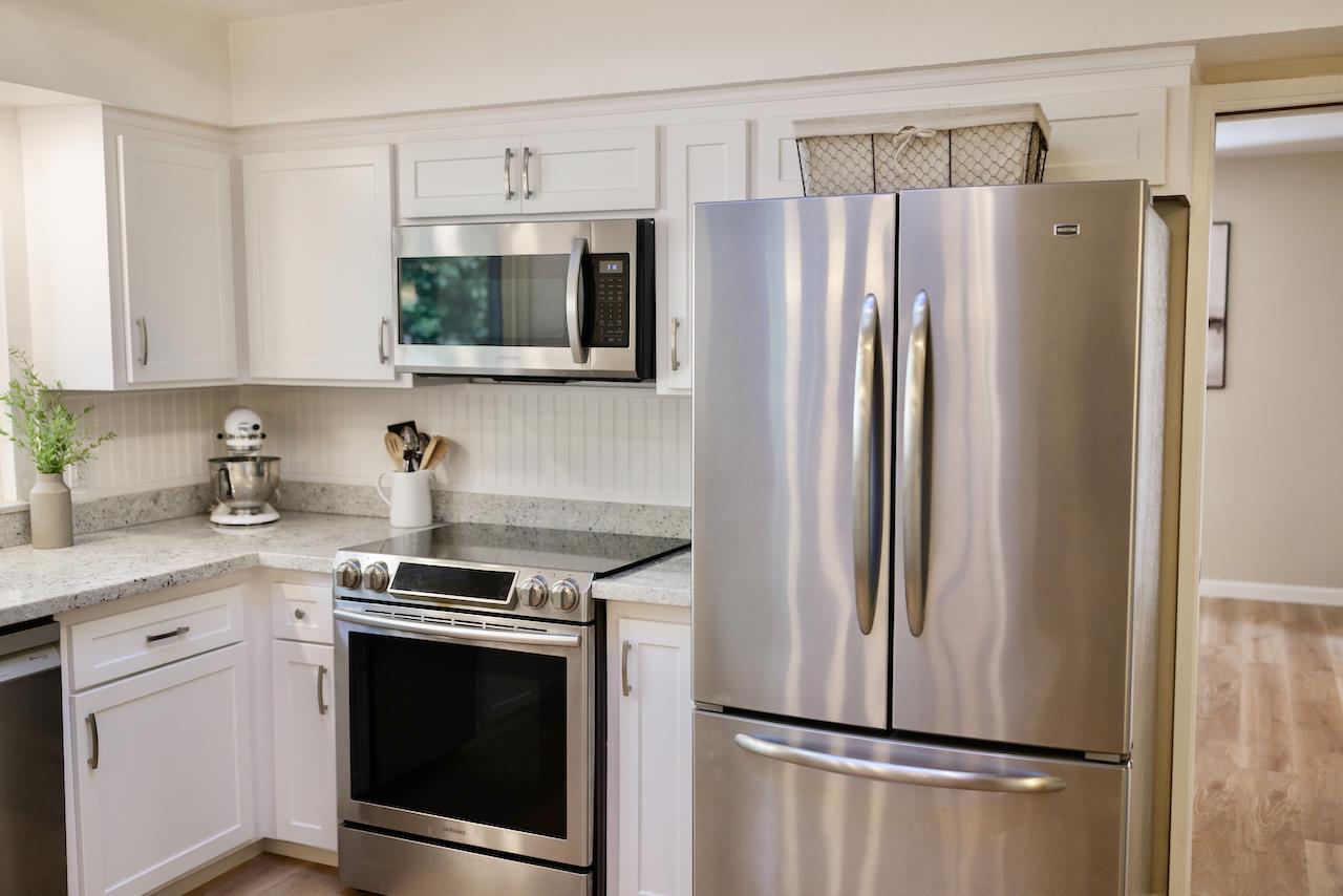 155 Rabbits Run Road Santa Cruz, CA 95060 - Photo 31 of 113 a kitchen with stainless steel appliances a refrigerator sink and microwave