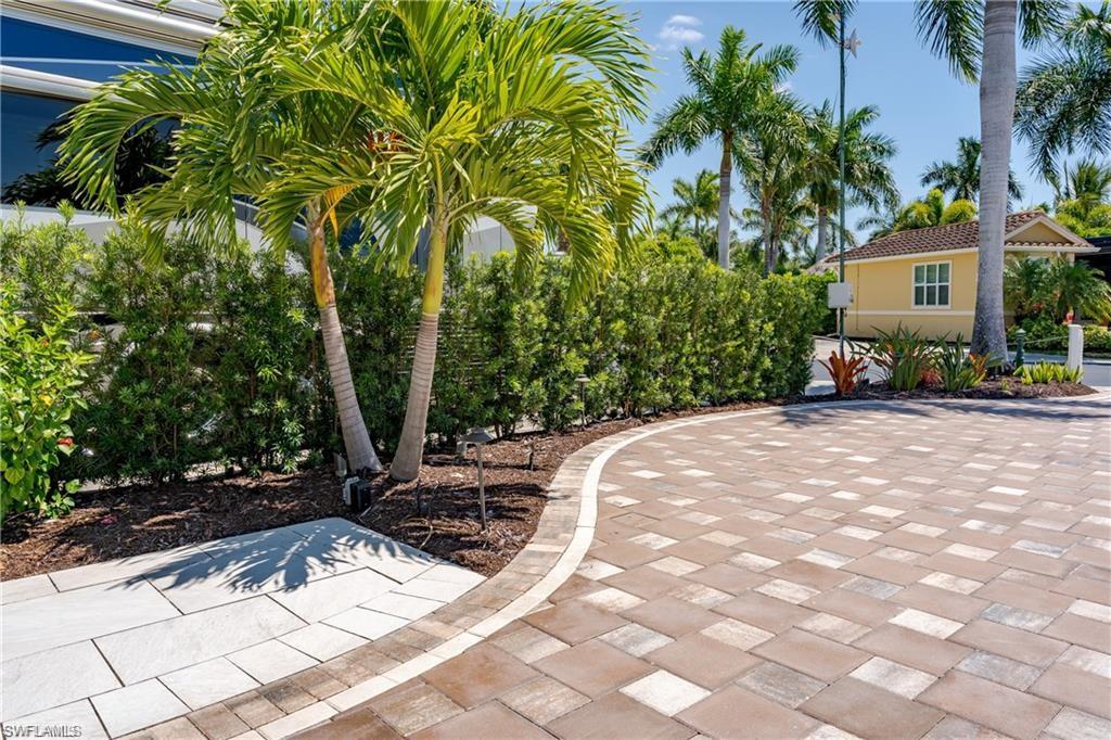 13461 Ladyfish Lane Naples, FL 34114 - Photo 13 of 30 a view of a backyard with a sitting area