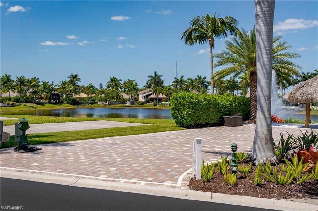 13461 Ladyfish Lane Naples, FL 34114 - Photo 16 of 30 a view of a yard with a table and plants