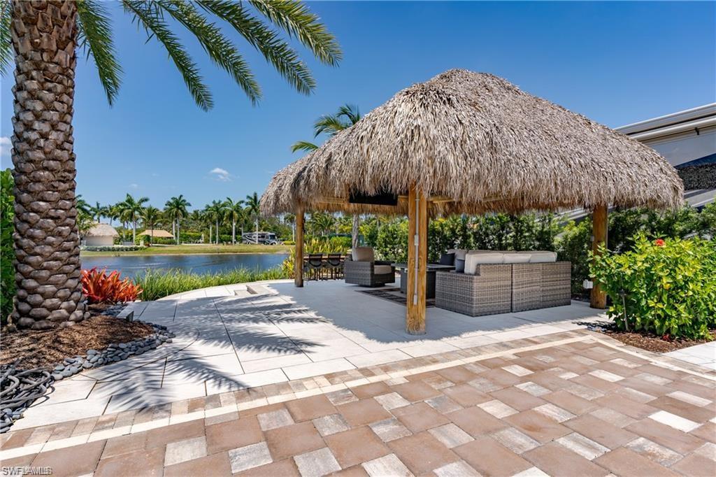 13461 Ladyfish Lane Naples, FL 34114 - Photo 5 of 30 a view of a backyard with sitting area and furniture