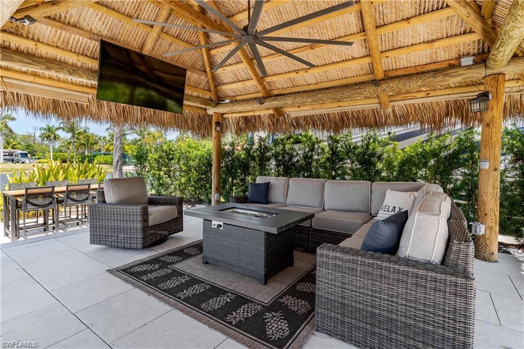 13461 Ladyfish Lane Naples, FL 34114 - Photo 8 of 30 a view of a patio with couches and potted plants