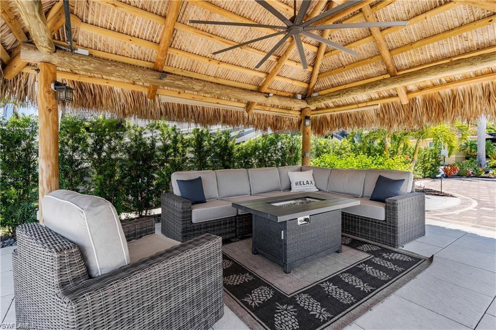 13461 Ladyfish Lane Naples, FL 34114 - Photo 10 of 30 a roof deck with couches and wooden fence