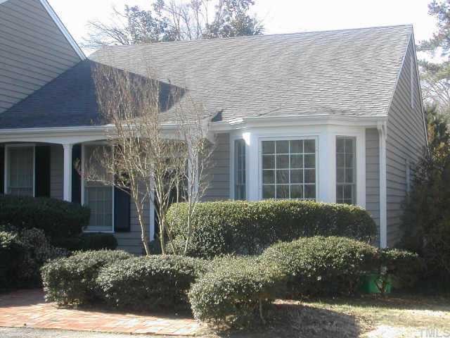 2633 Ashland Street Raleigh, NC 27608 - Photo 1 of 1 a view of a house with a yard and potted plants