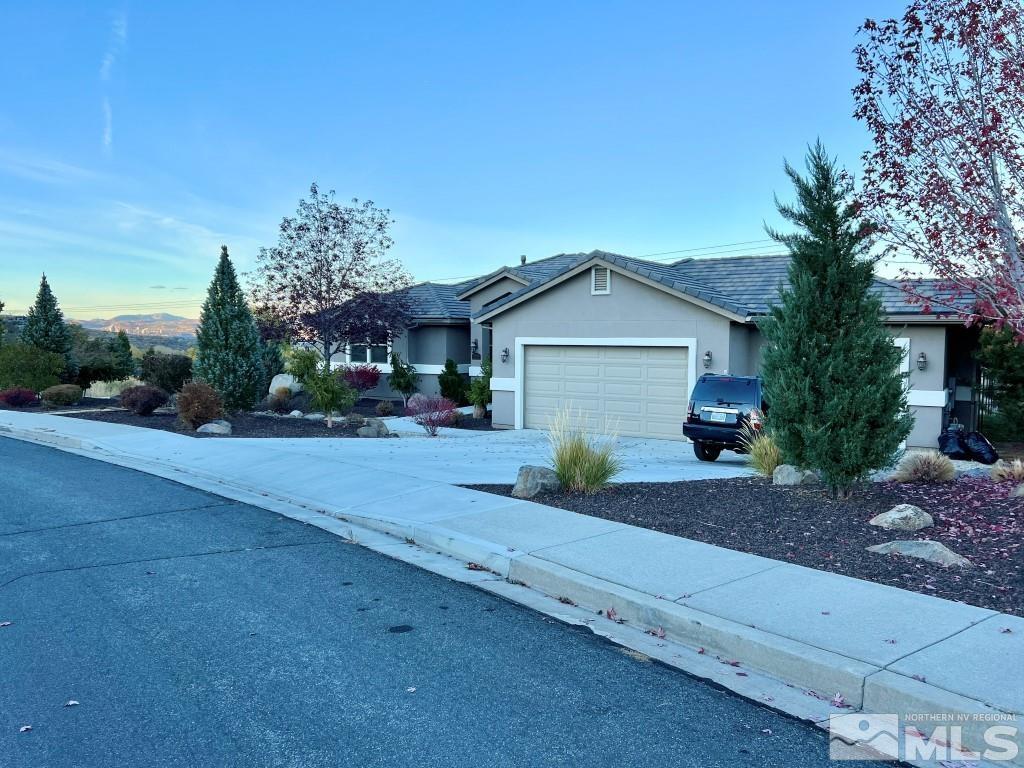 4960 Gila Bend Road Reno, NV 89511 - Photo 33 of 33 a front view of a house with a yard and garage
