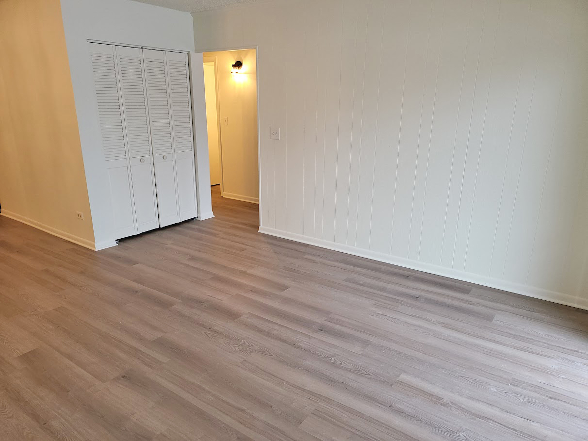 945 North Rohlwing Road, Unit GM Addison, IL 60101 - Photo 5 of 14 a view of an empty room with wooden floor