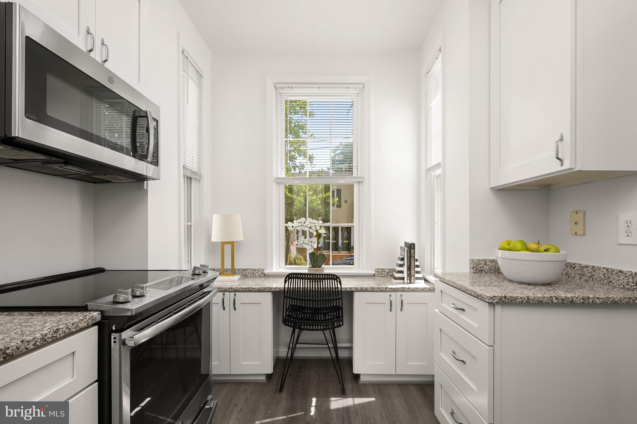 2805 Olive Street Northwest Washington, DC 20007 - Photo 13 of 30 a kitchen with a stove and a sink