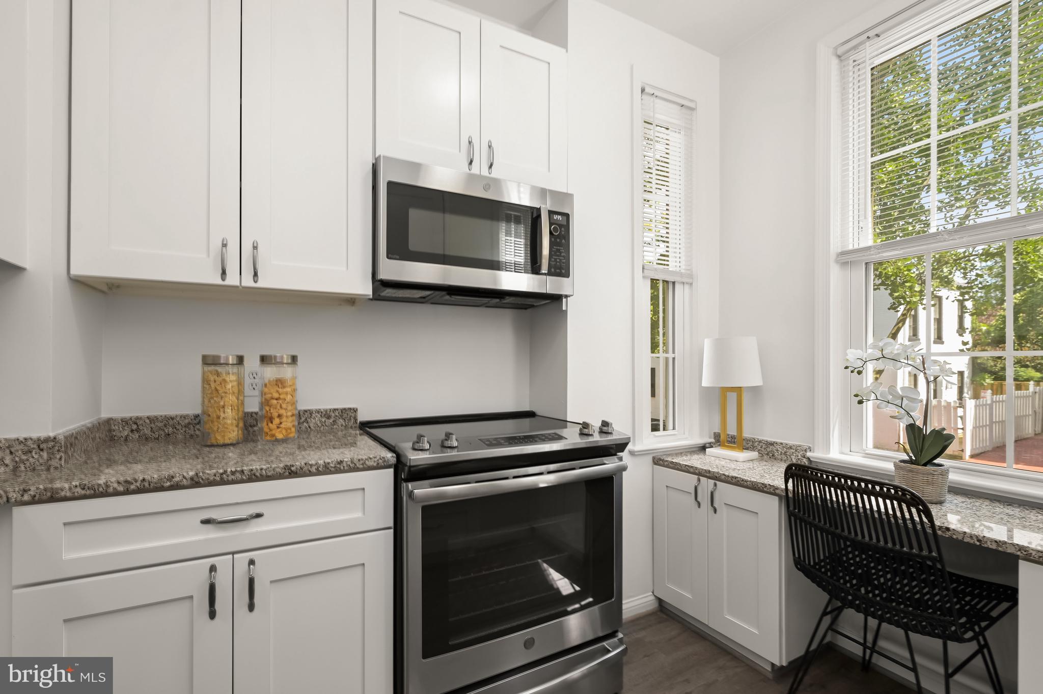 2805 Olive Street Northwest Washington, DC 20007 - Photo 14 of 30 a kitchen with stainless steel appliances granite countertop a stove a sink and a microwave