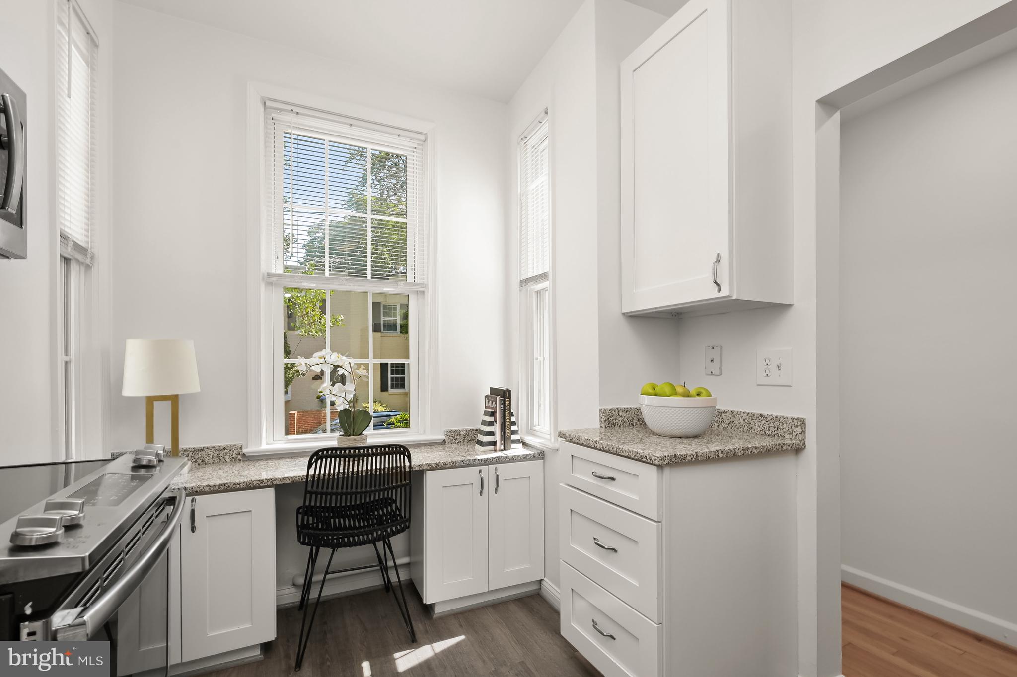 2805 Olive Street Northwest Washington, DC 20007 - Photo 15 of 30 a kitchen with a sink stove and cabinets