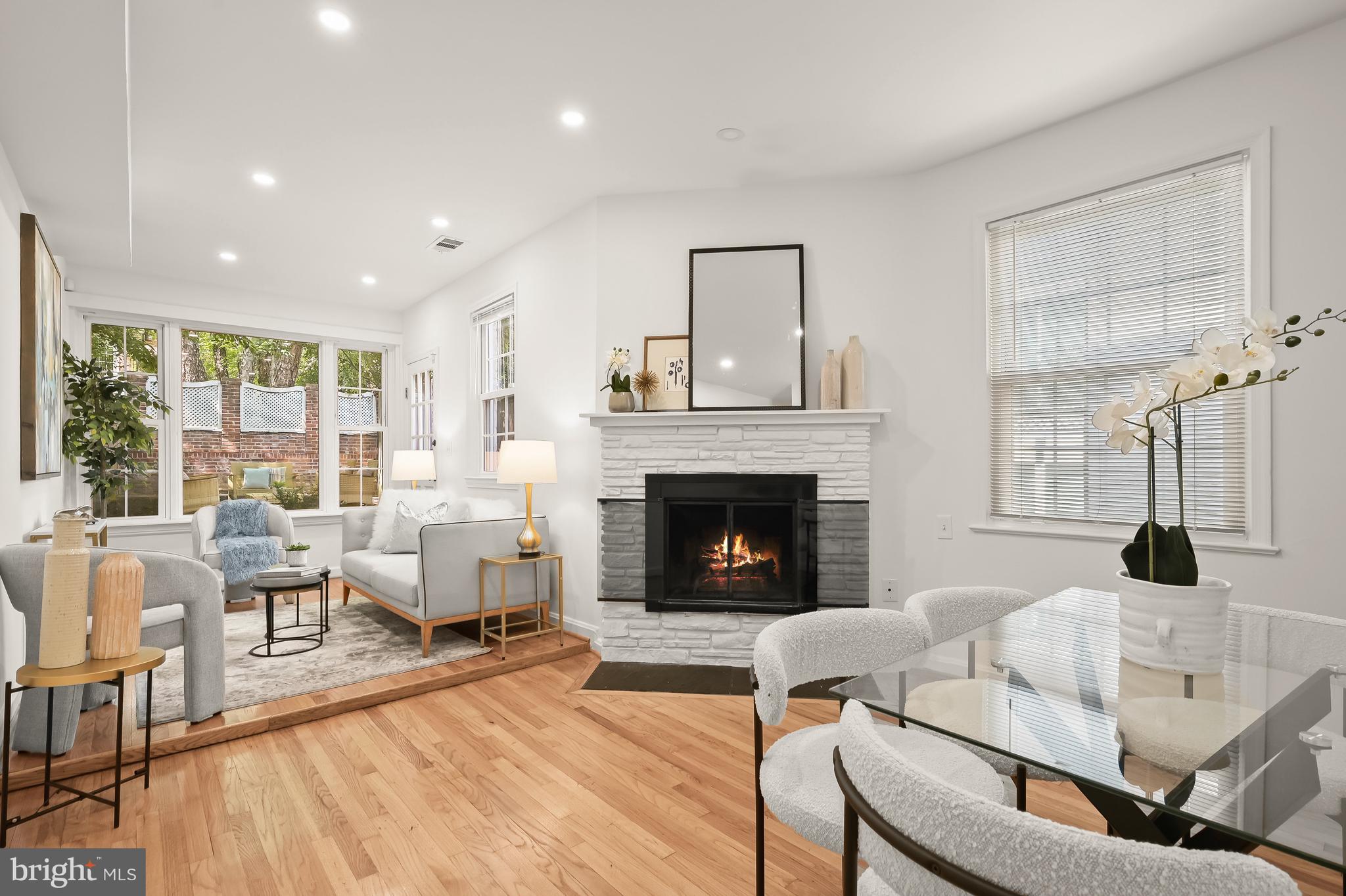2805 Olive Street Northwest Washington, DC 20007 - Photo 2 of 30 a living room with furniture and a fireplace