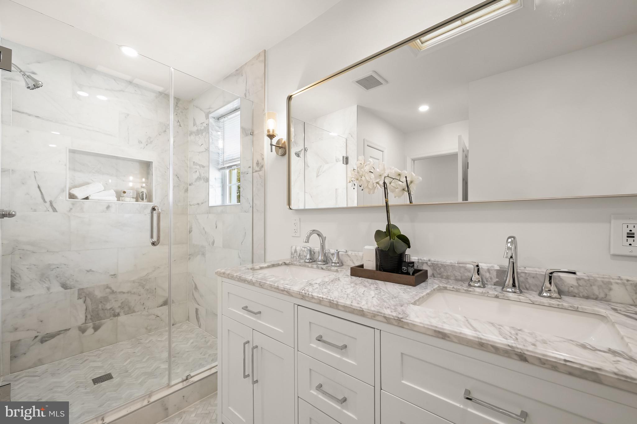 2805 Olive Street Northwest Washington, DC 20007 - Photo 22 of 30 a bathroom with double vanity and a shower