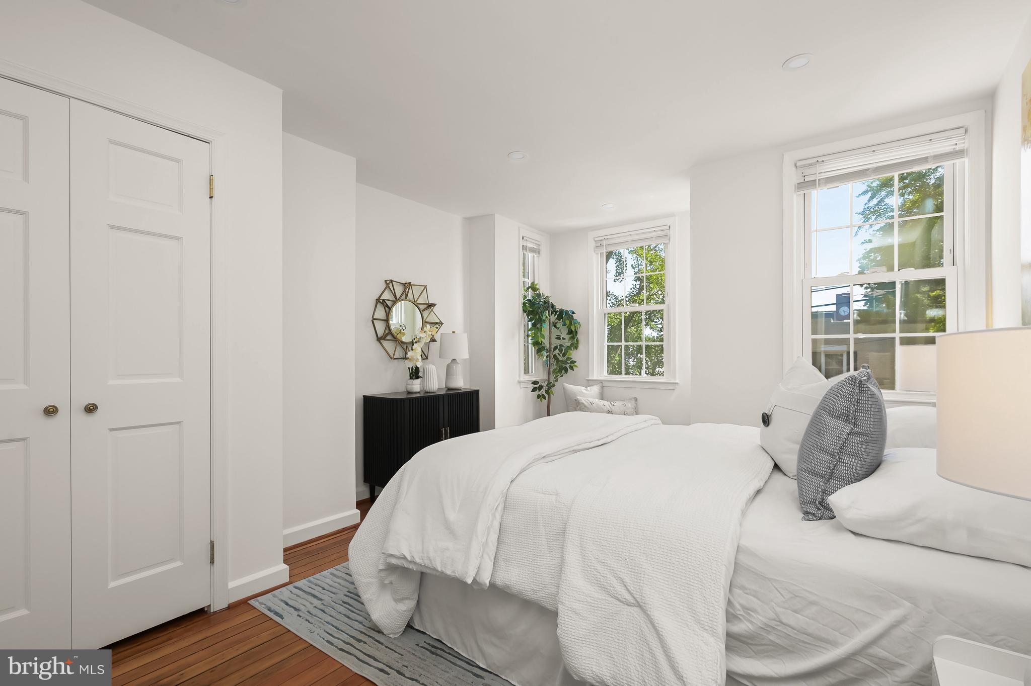 2805 Olive Street Northwest Washington, DC 20007 - Photo 24 of 30 a bedroom with a bed and wooden floor