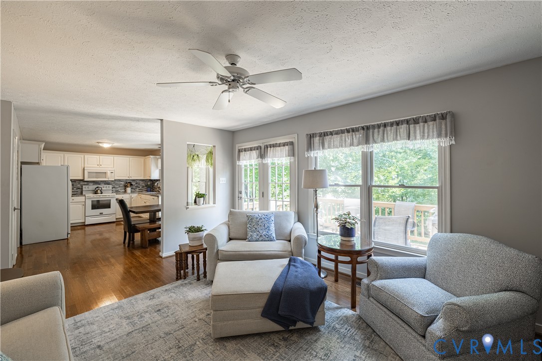 4501 Foxwood Road Chester, VA 23831 - Photo 16 of 42 Living area with neutral wall tones and wood-finis