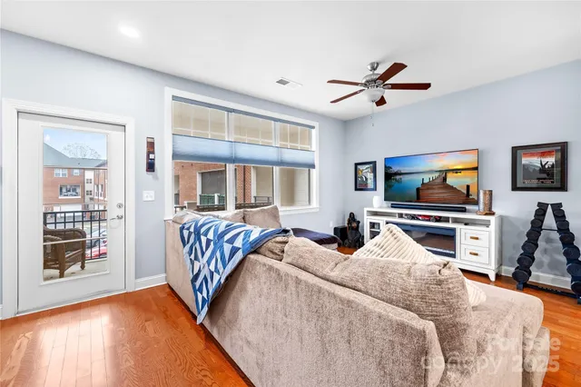 a bedroom with bed and flat screen tv