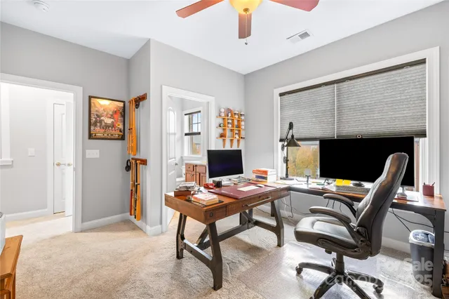 a workspace with a table and chairs