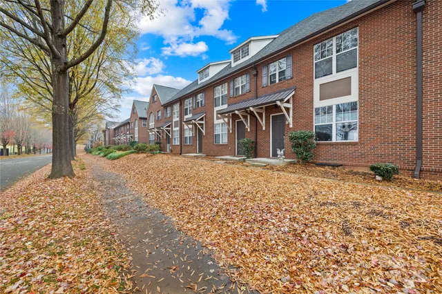 a front view of a building with a yard