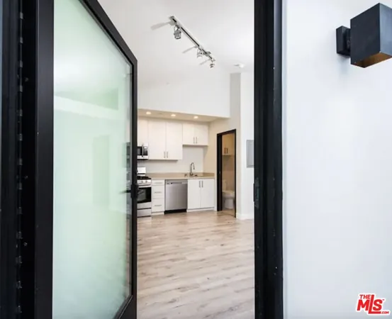 a view of a kitchen from the hallway
