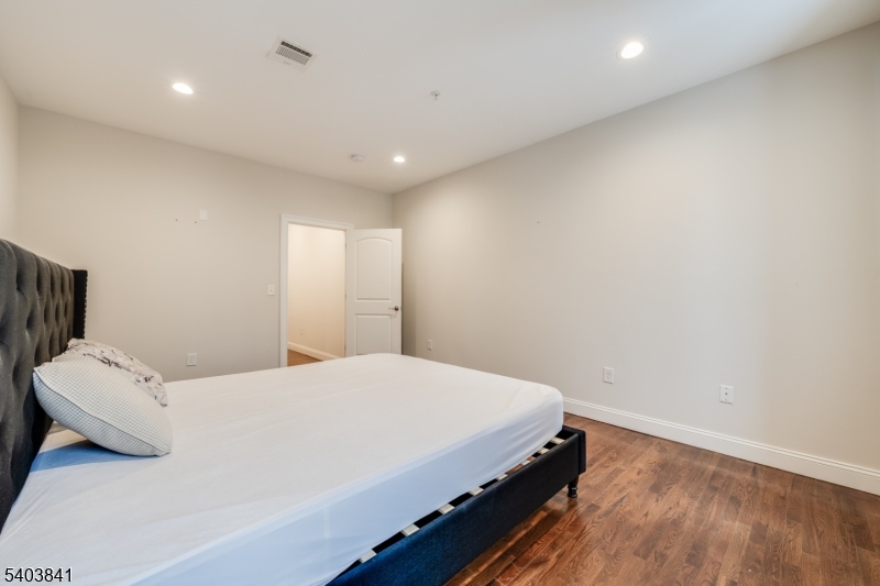 231 River Road, Unit 231 Somerville, NJ 08876 - Photo 18 of 31 a bedroom with a bed and a large window